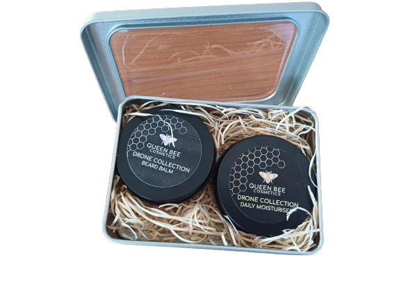 Open metal gift set with mens moisturising cream and beard balm in metal tins. 