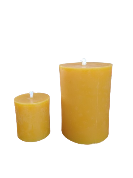 Small and large natural beeswax pillar candle