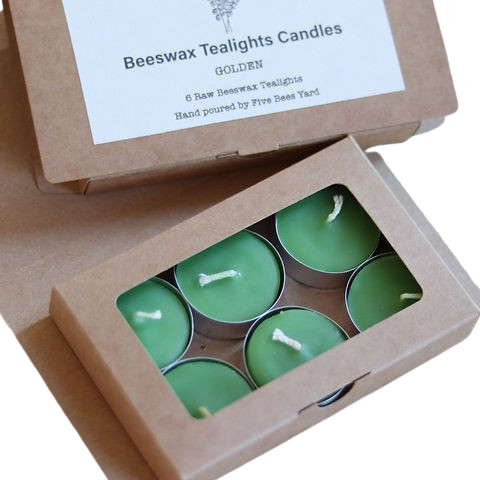 Box of green beeswax tealights with a visible brand label.