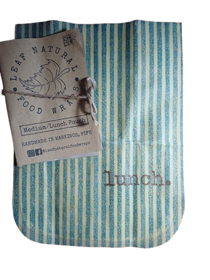 Blue and white striped reusable beeswax food wrap with a label on a white background