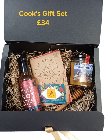 Cook's gift set with hot sauce, honey, and other items in a box labeled 'Cook's Gift Set £34'.