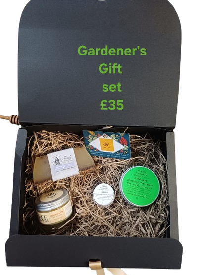 Gardener's gift set with various items in a black box labeled 'Gardener's Gift Set £35'.