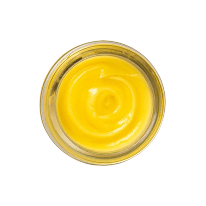 Yellow cream in a glass jar on a white background
