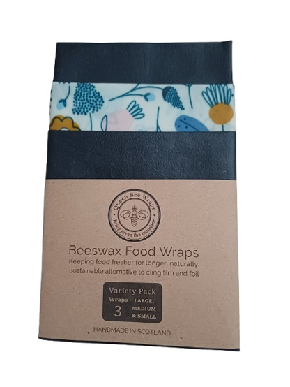 3 sizes of Beeswax food wraps packaging with floral design on a white background