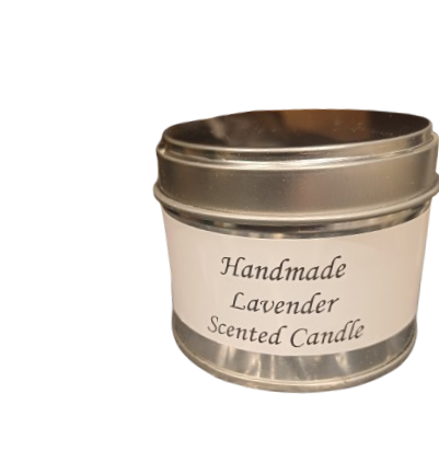 Handmade lavender scented candle in a metal tin on a white background