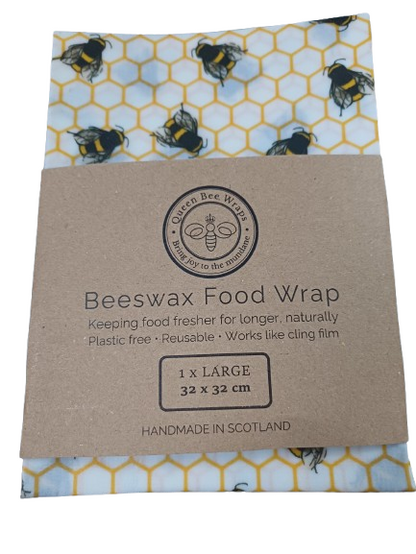 beeswax wrap with bee print in cardboard sleeve with white background